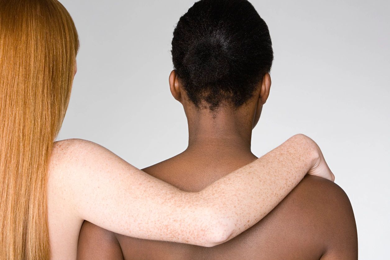 Two individuals embracing, showing support and connection.
